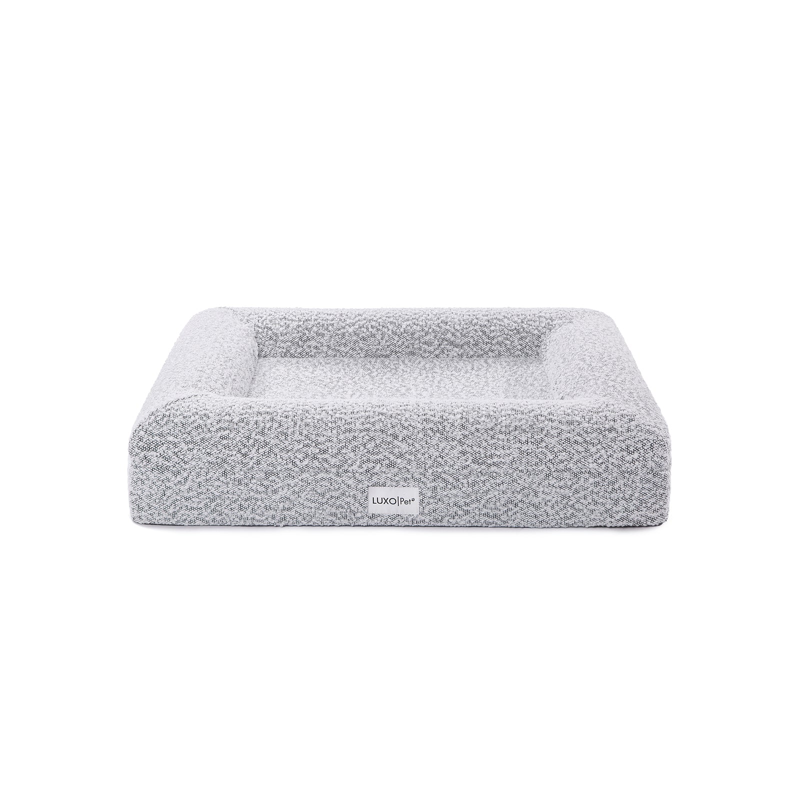 Tyro Luxe Small Orthopedic Pet Bed – Black & White, featuring a close-up of its soft boucle fabric and high-density memory foam base, designed for joint support and modern home aesthetics.