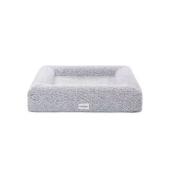Tyro Luxe Small Orthopedic Pet Bed – Black & White, featuring a close-up of its soft boucle fabric and high-density memory foam base, designed for joint support and modern home aesthetics.