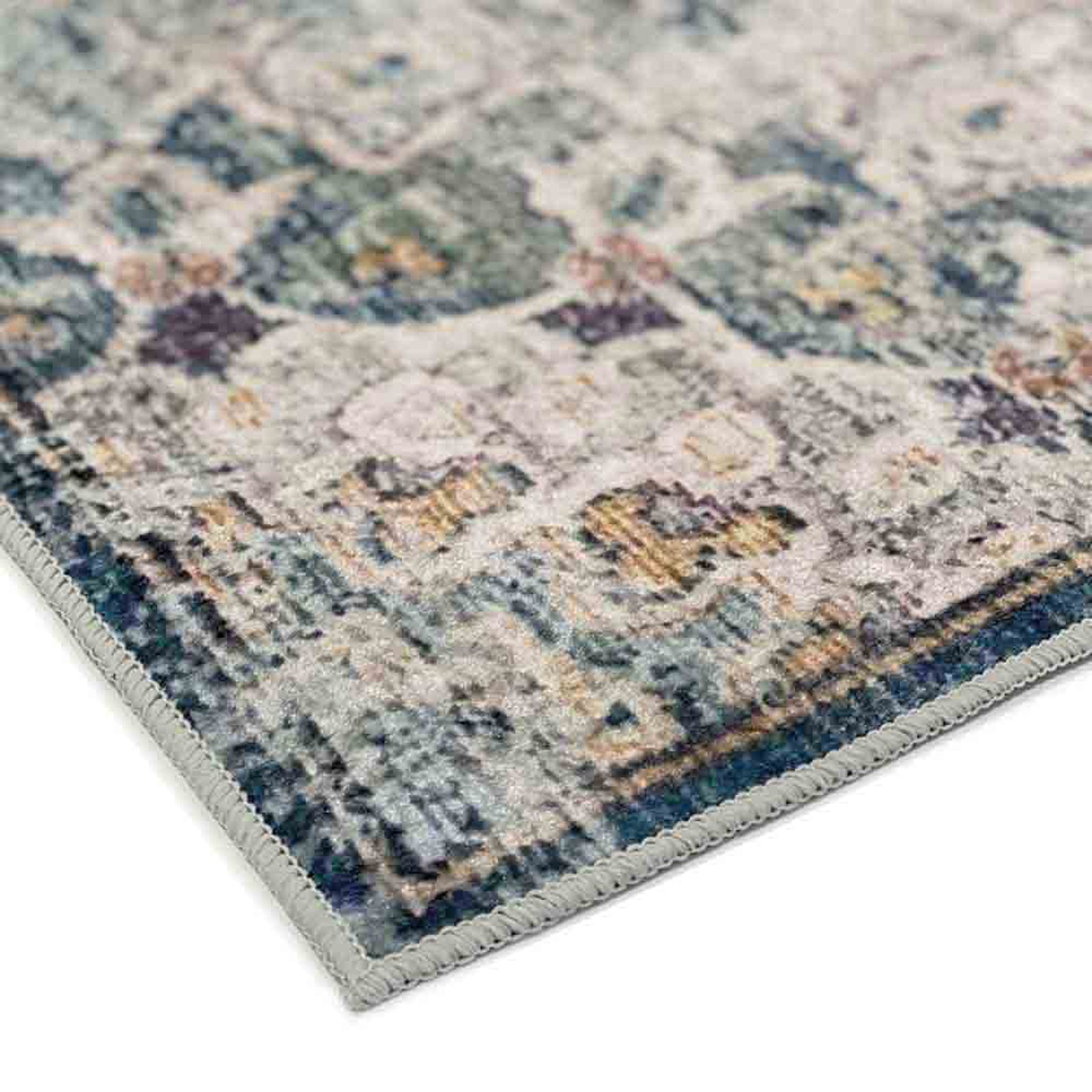 Close-up of Ariza 200cmx300cm Large Persian Silky Indoor Floor Rug, showcasing its over-locked edge and distressed ornamental pattern with muted tones, exemplifying its vintage, Persian-inspired design.