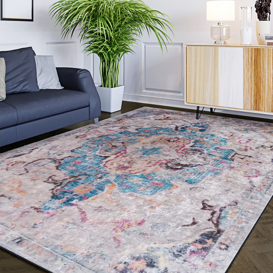 Arwani 200x300cm Large Traditional Persian Indoor Rug with a distressed multicolored medallion pattern, enhancing the contemporary living-room corner with a dark gray sofa and a two-tone sideboard.