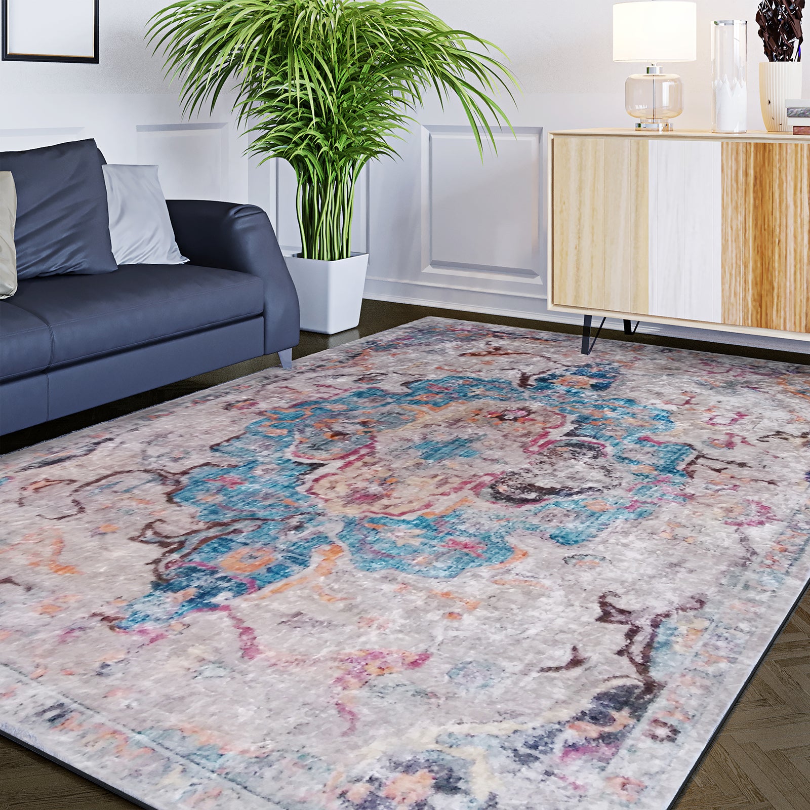 Arwani 200x300cm Large Traditional Persian Indoor Rug with a distressed multicolored medallion pattern, enhancing the contemporary living-room corner with a dark gray sofa and a two-tone sideboard.