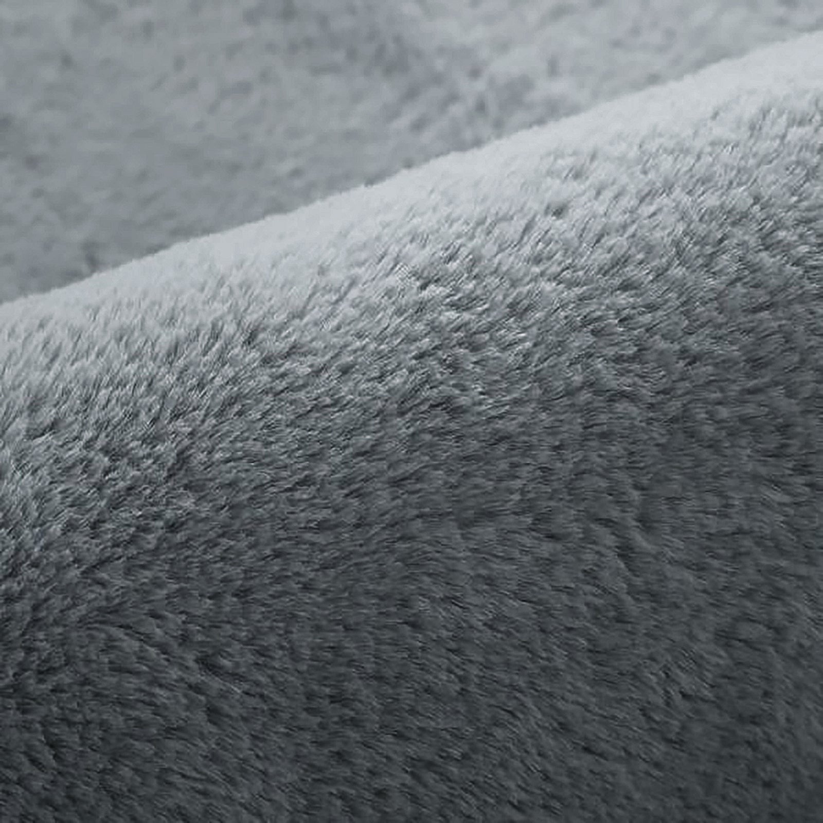Close-up of Azaliya Dark Grey Faux Rabbit Fur Rug 200x300cm, showcasing its plush, fuzzy texture resembling soft fleece, ideal for adding luxurious comfort to modern or minimalist interiors.