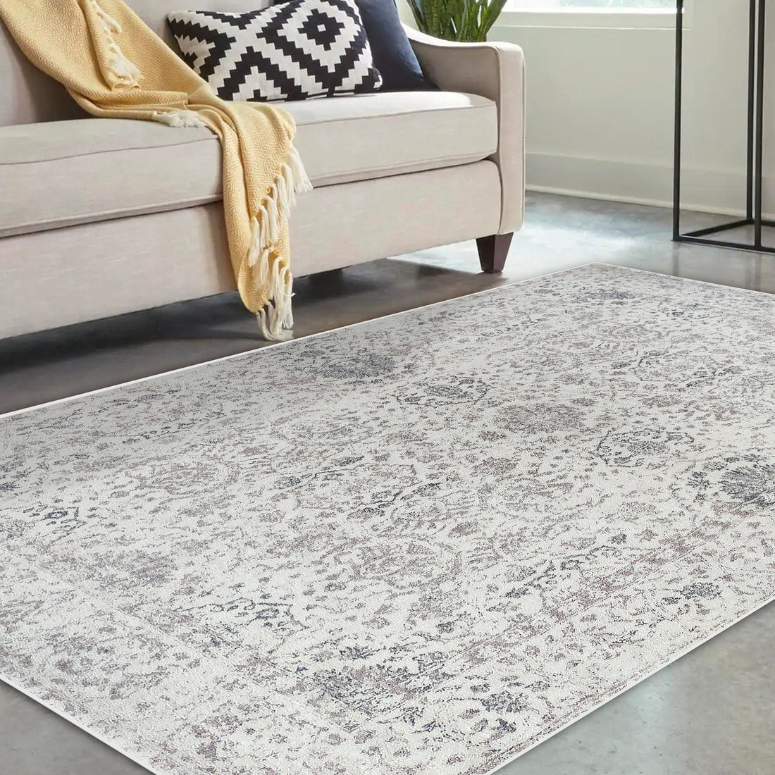 Cesco 200x300cm Polyester Persian Printed Indoor Floor Rug features a subtle, distressed medallion pattern in muted grays and taupes, enhancing the modern living room's elegance with its intricate design.