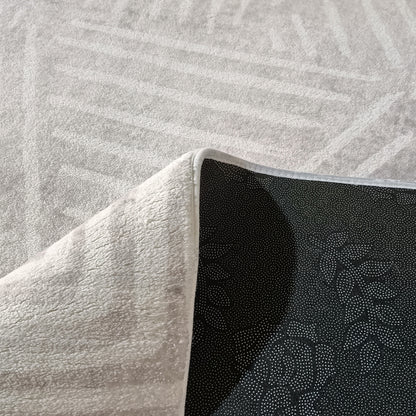 Duved 200x300cm Large Contemporary Indoor Floor Rug with light-grey terry-cloth appearance, flipped corner showing black dotted anti-slip backing, ideal for modern interiors with a plush feel.