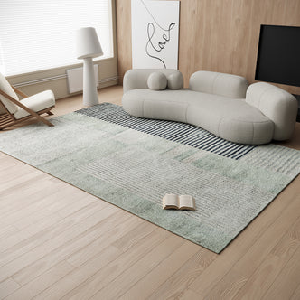 Elimas 200x300cm Soft Contemporary Printed Floor Rug lies on the floor, showcasing its muted navy and pale green stripes, complementing the minimalist living room's organic sofa and wood-paneled backdrop.