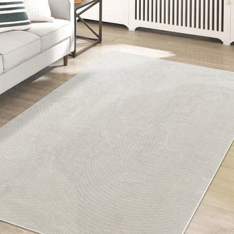 Lita 160x230cm Polyester Tufted Modern Abstract Rug enhances the minimal living space, showcasing its tufted design and plush texture over natural wood-tone floorboards, complementing the contemporary decor.