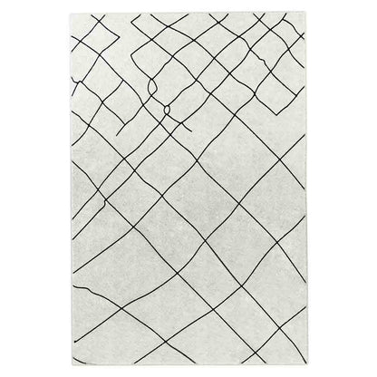 Melody Black & White Modern Rug 120x170cm showcases black abstract lines on an ivory surface, embodying a Scandinavian-inspired design ideal for complementing vibrant furniture with its subtle and timeless aesthetic.