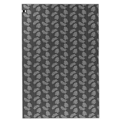 Melody Black & White Modern Rug 120x170cm showcases a Scandinavian-inspired design with black abstract lines on an ivory backdrop, ideal for complementing vibrant furniture in living or dining areas.