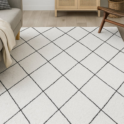Milani 160x230cm Contemporary Printed Indoor Floor Rug with a light-cream base and black grid pattern dominates the living room scene, complemented by a nearby beige sofa and wooden furniture.