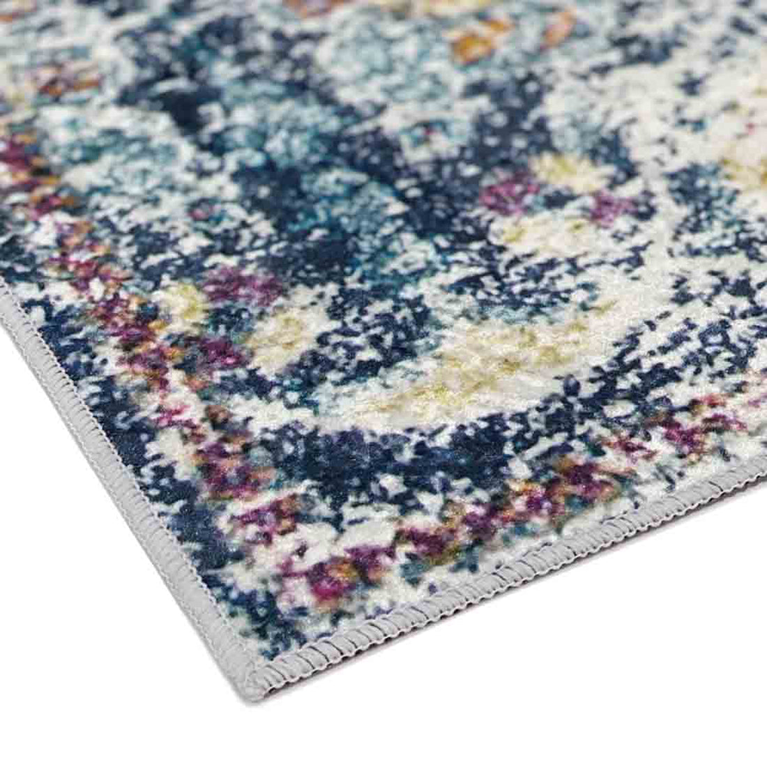 Morgan Distressed Persian Silky Rug 160x230cm showcases a close-up of its classic medallion design with intricate patterns, highlighting the rug's vintage-inspired, over-dyed distressed texture and transitional style.