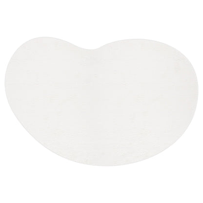 Parna Curved 240x330cm Large Shag Rug in Cream White, featuring a plush, kidney-bean shape with a softly textured, irregular oval design and a slight inward curve along the top edge.