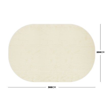 Pavla 200 x 300cm Oval Shaggy Rug in Beige, showcasing its large, oval shape and plush texture, laid flat on a white background, highlighting its inviting and cosy appeal for home décor.