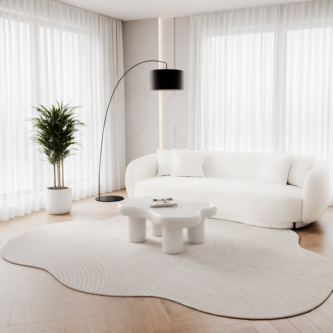 Penina 300 x 400cm Cloud Soft Rug in Neutral in a light-filled room, with a sculptural coffee table, curvy sofa, and tall plant, enhancing the airy, minimalist ambiance.