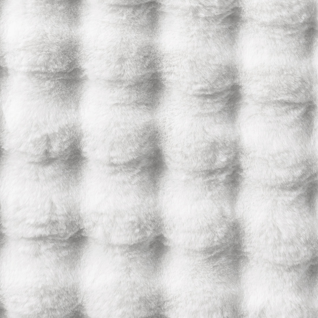 Severa 180x300cm Fluffy Textured Bubble Rug in White, showcasing a close-up of its soft, quilted faux-fur surface arranged in a subtle grid pattern, highlighting its luxurious and cozy texture.