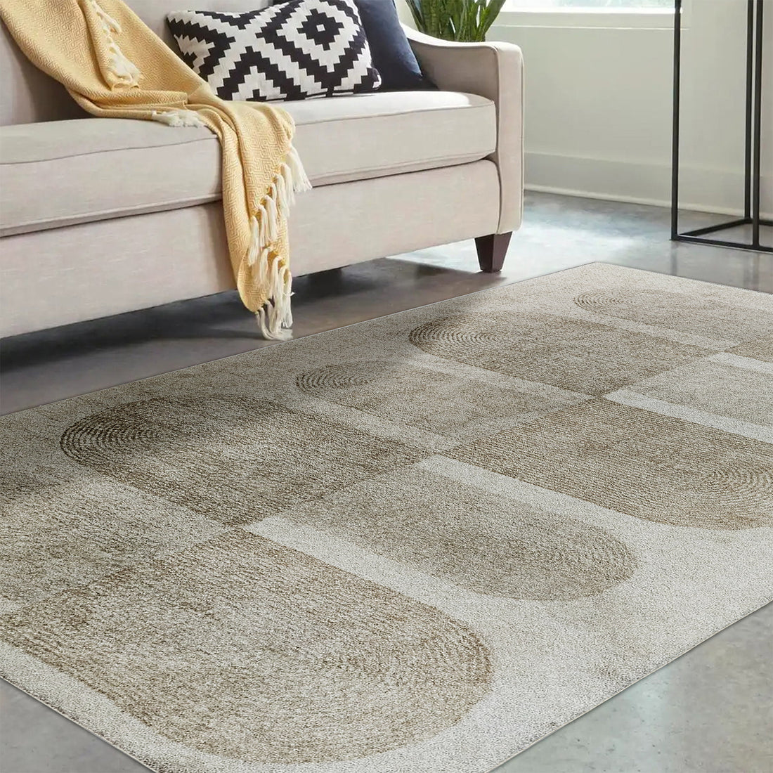 Tyche Soft Contemporary Printed Floor Rug 200 x 300cm showcased in a living room, highlighting its plush texture and intricate pattern, fitting seamlessly beneath a couch with a black and white pillow and yellow blanket.