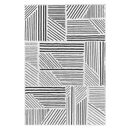Vikki 200x300cm Large Abstract Contemporary Floor Rug with light-gray/off-white base features black geometric line patterns in rectangular and triangular formations, enhancing modern decor with its art deco design.