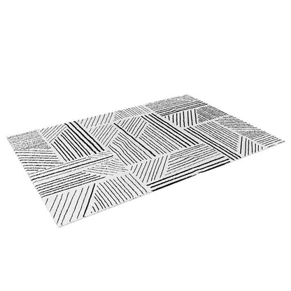 Vikki 200x300cm Large Abstract Contemporary Floor Rug featuring a geometric pattern of diagonal black and dark gray stripes over a white background, offering a modern, tribal-inspired aesthetic for versatile decor.