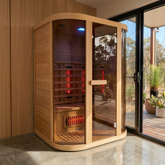 Infrared sauna installed in a modern room near sliding glass doors