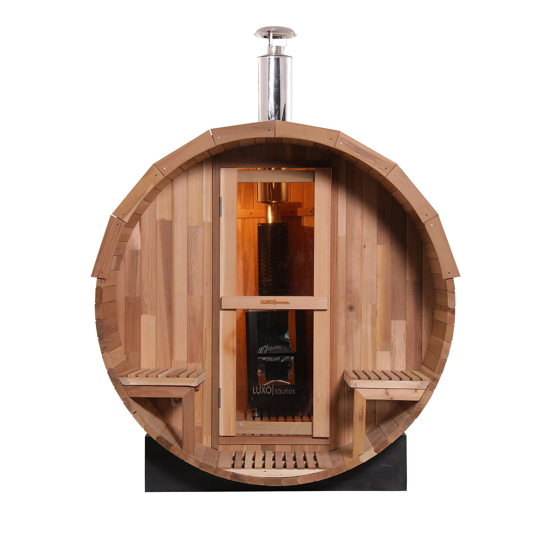 Luola 4-Person Red Cedar Barrel Sauna with Wood Stove, showcasing its robust wooden barrel design and metal stove, ideal for outdoor relaxation and wellness.