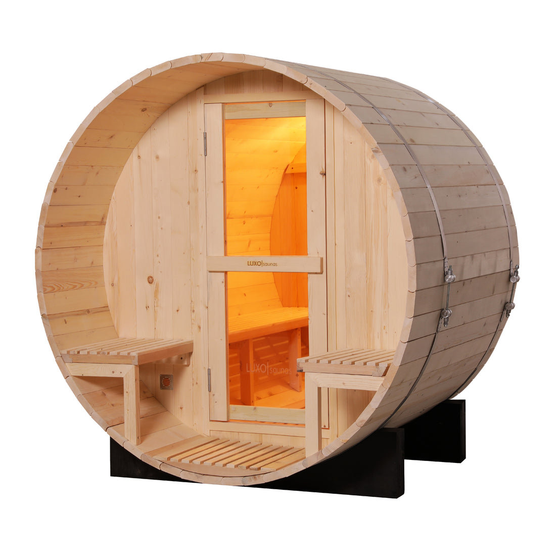 Luola 2 Person Pine Outdoor Barrel Sauna & Harvia Stove features a barrel-shaped design, glass-paneled door, front porch with bench seats, and a warmly lit interior for backyard relaxation.