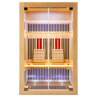 Close-up view of the Runko 2 Person Canadian Hemlock Carbon Fibre Infrared Sauna, highlighting the sleek wood slat design, precise wall construction, and an elegant sign marking its innovative, artistic craftsmanship.