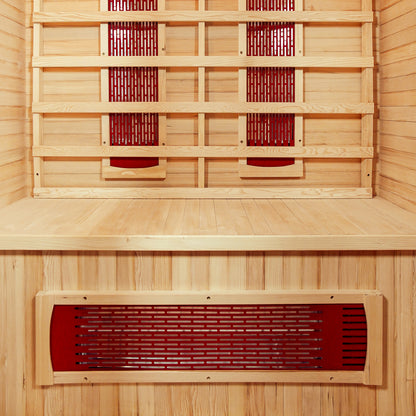 Taavi 2 Person Ceramic Infrared Indoor Home Sauna interior features light-colored wood planking with slatted backrest and visible reddish ceramic heater panels, designed for relaxation and therapeutic heat therapy at home.