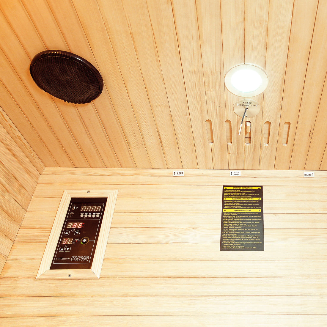 Taavi 2 Person Ceramic Infrared Indoor Home Sauna ceiling view showing a round speaker, recessed light with TEMP SENSOR, safety label, and LUXUSAUNA digital control panel with LED readouts and buttons.