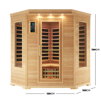 Taavi 4 Person Corner Carbon Fibre Infrared Indoor Sauna with an octagonal-front, three tempered-glass windows, digital control panel, recessed lights, and Canadian Hemlock wood, ideal for indoor relaxation.
