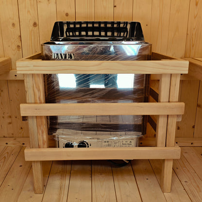 Tarni 2-Person Finnish Outdoor Sauna – Fir Wood features a Davey electric heater with a protective wooden guard, installed in a wood-paneled sauna cabin for backyard relaxation and wellness.