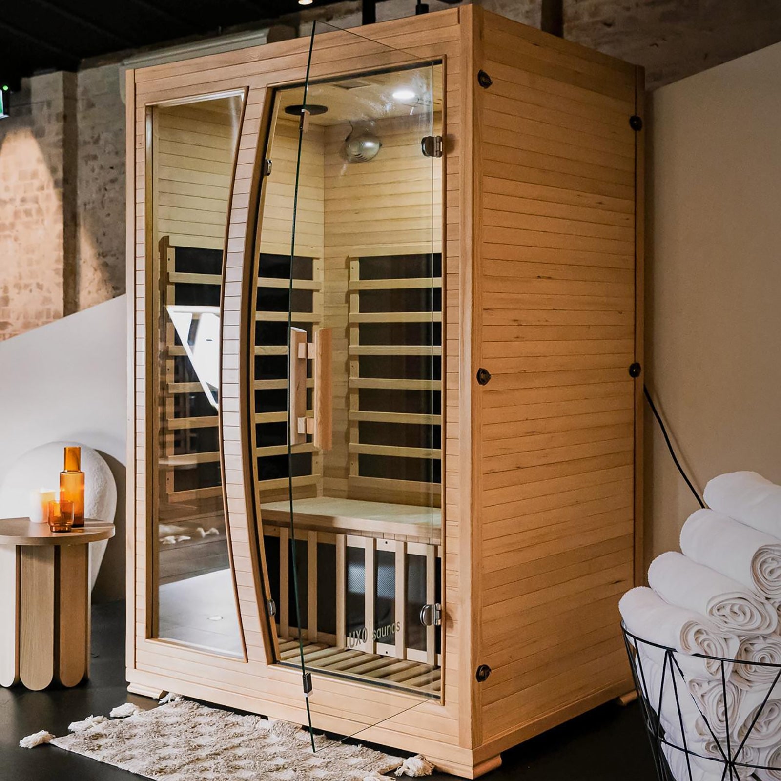 Valo 2-Person Canadian Hemlock Carbon Fibre Home Sauna Cabin with glass doors, showcasing a wooden structure made from durable Canadian Hemlock, designed for indoor use with infrared heating panels.