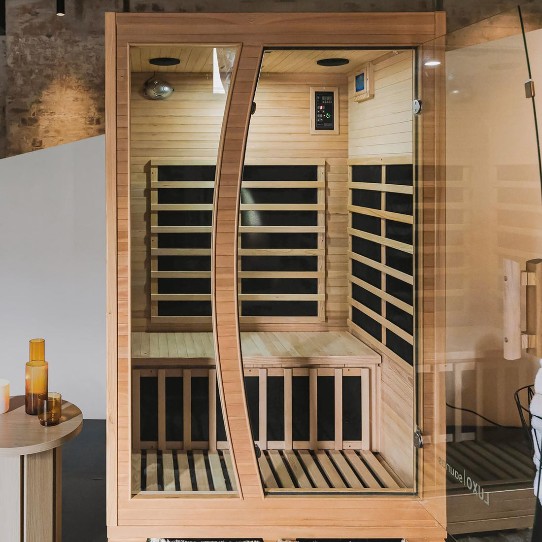 Valo 2-Person Canadian Hemlock Carbon Fibre Home Sauna Cabin with glass doors, control panel, and sleek wooden design, ideal for indoor relaxation and wellness.