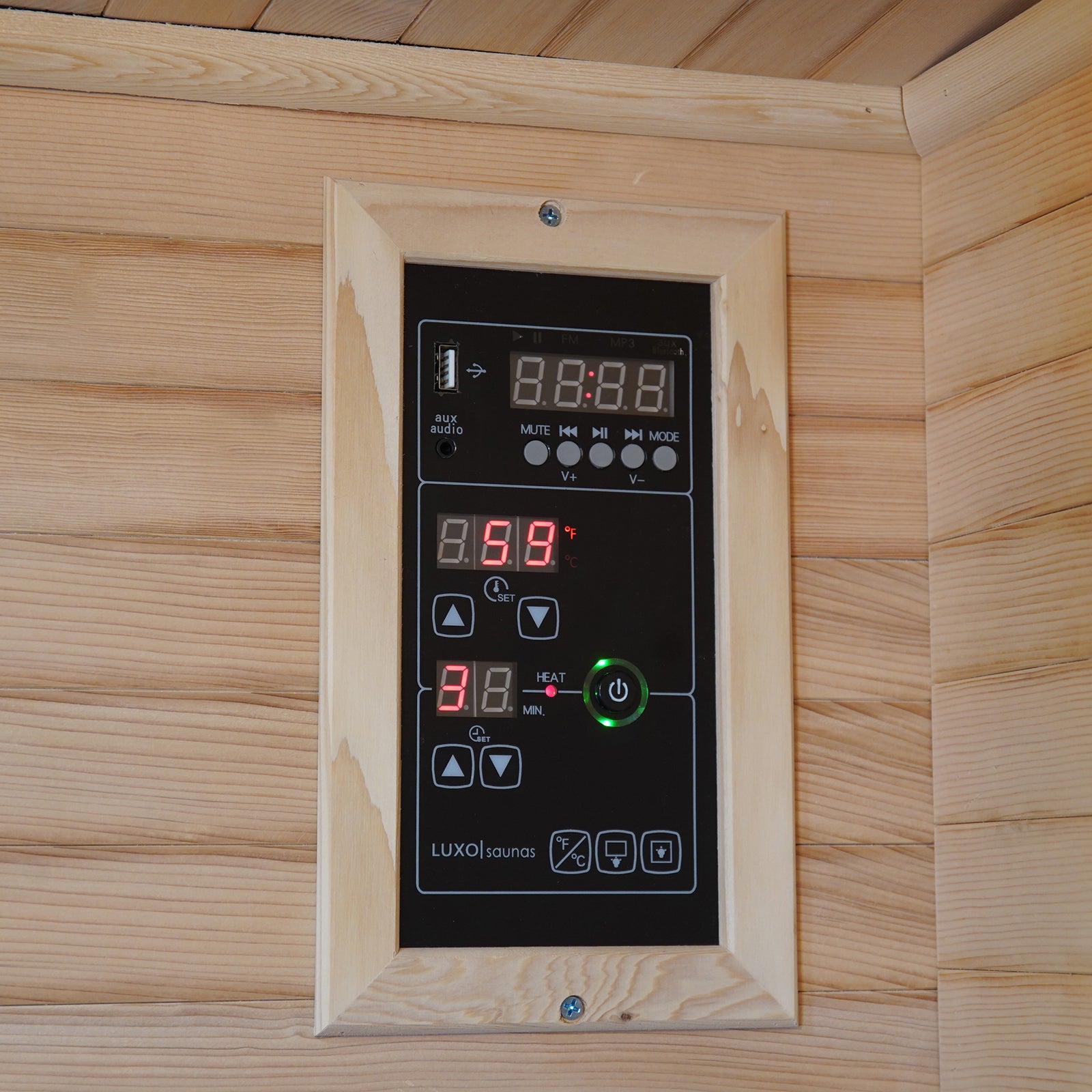 Close-up of the Valo 2-Person Canadian Hemlock Carbon Fibre Home Sauna Cabin, featuring a lit power button and digital control panel, emphasizing its modern design and functionality.
