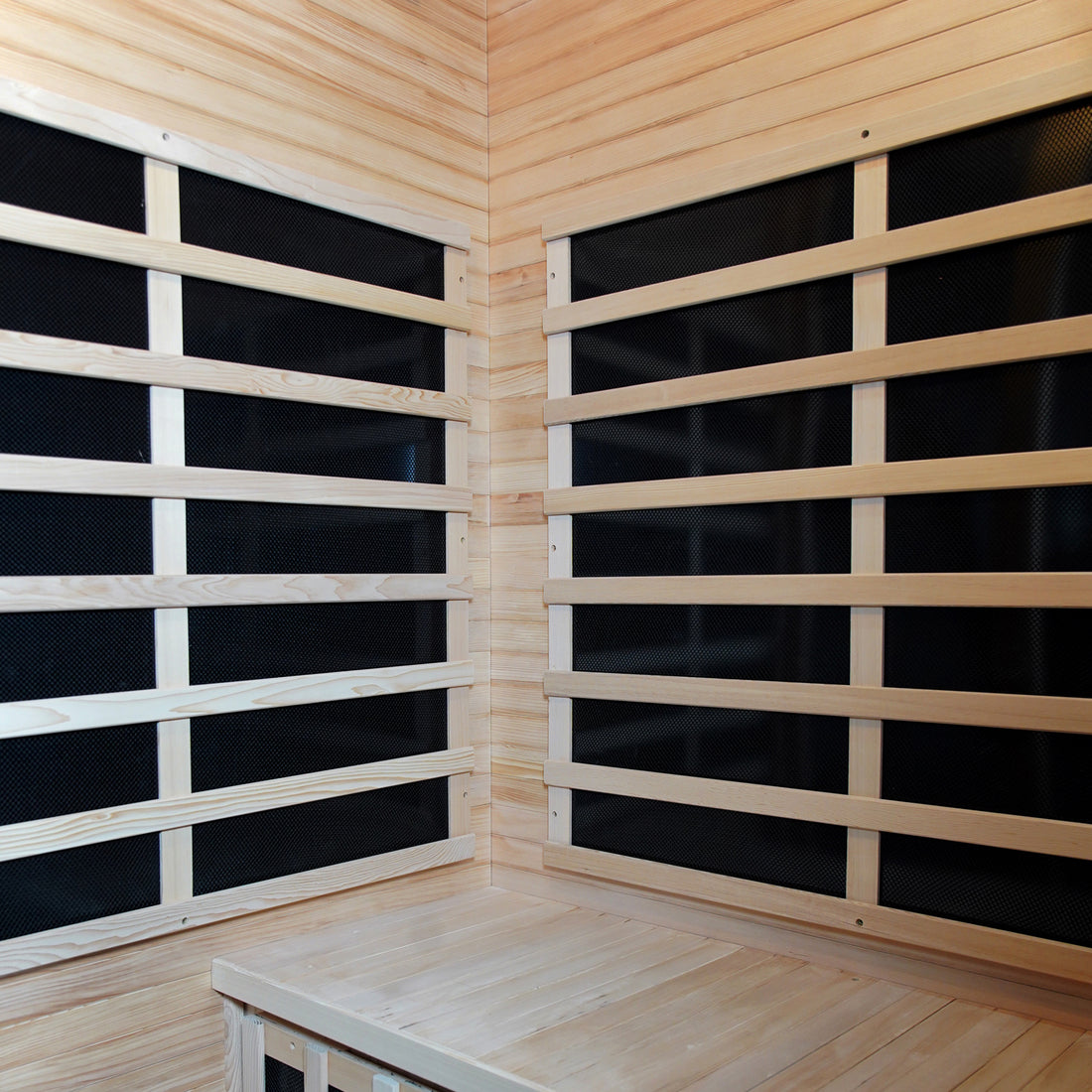 Valo 2-Person Canadian Hemlock Carbon Fibre Home Sauna Cabin featuring a close-up of its hardwood construction, wooden slats, and corner detailing, showcasing durable Canadian Hemlock wood for a luxurious sauna experience.