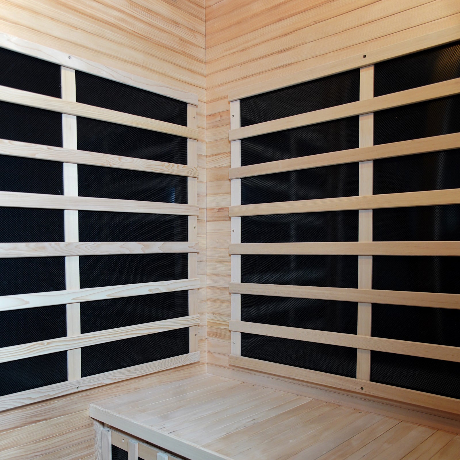 Valo 2-Person Canadian Hemlock Carbon Fibre Home Sauna Cabin featuring a close-up of its hardwood construction, wooden slats, and corner detailing, showcasing durable Canadian Hemlock wood for a luxurious sauna experience.
