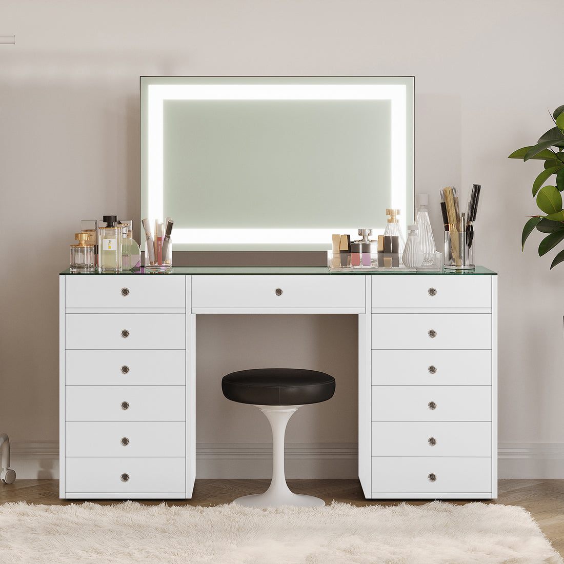 Adeline Makeup Vanity Table with LED Mirror in White features a sleek desk with a glass top, LED-lit mirror, and organized beauty essentials, complemented by a tulip-style stool for a modern aesthetic.