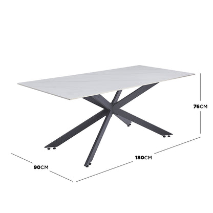 Alfred 180cm Modern Pedestal Dining Table - White Marble features a light-colored marble-effect top and a sculptural black steel base, offering stylish elegance and ample legroom for six people.