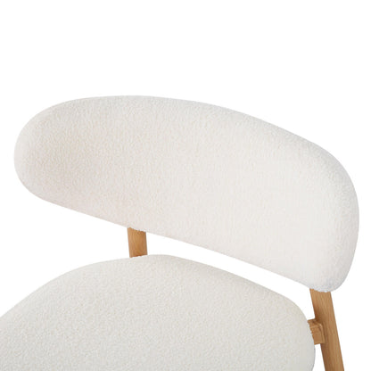 Audrey Curved Bar Stool & Dining Chair Set of 4 in Cream White features plush, cream-white boucle fabric on a modern, light wooden frame, highlighting the elegant, curved backrest and seat cushion design.