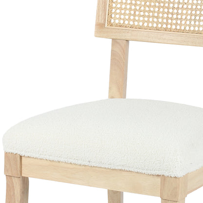 Avelino Hardwood & Rattan Dining Chair Set of 2 in Cream features light-toned wood legs, a woven cane backrest, and a thick, white bouclé-style seat cushion for luxury dining.