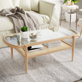 Ayesha Rattan American Oak Coffee Table with tempered-glass top and rattan shelf, showcasing a stylish rectangular design, situated in a living room setting with plant and fruit elements.