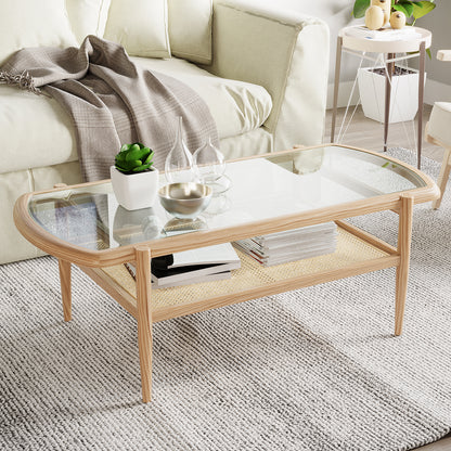 Ayesha Rattan American Oak Coffee Table with tempered-glass top and rattan shelf, showcasing a stylish rectangular design, situated in a living room setting with plant and fruit elements.