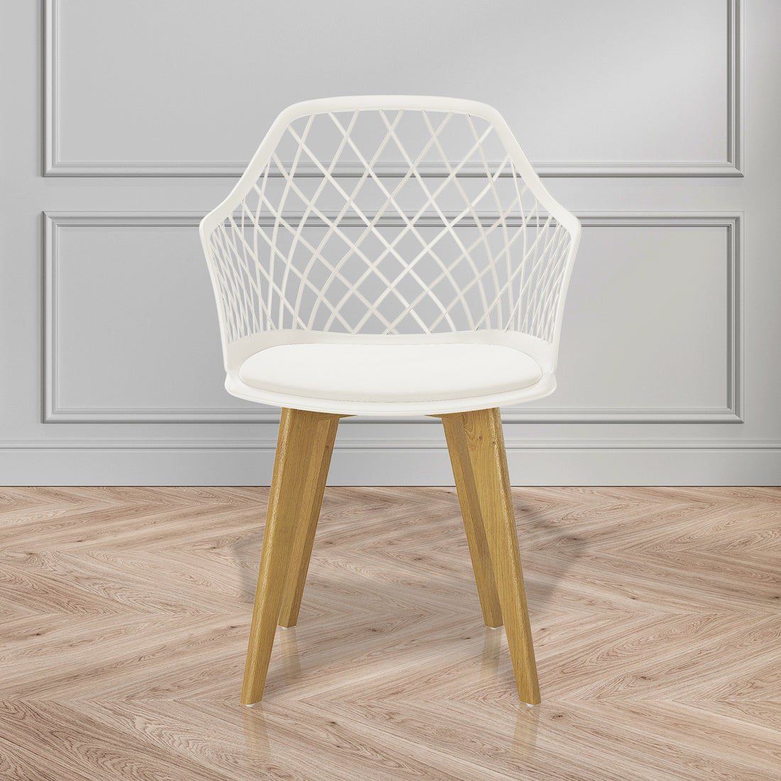 Caesar Beech Dining Chair Set of 4 in Cream White, featuring a white lattice-patterned plastic shell, smooth seat cushion, and angled wooden legs, displayed against a pale gray paneled wall on a herringbone floor.