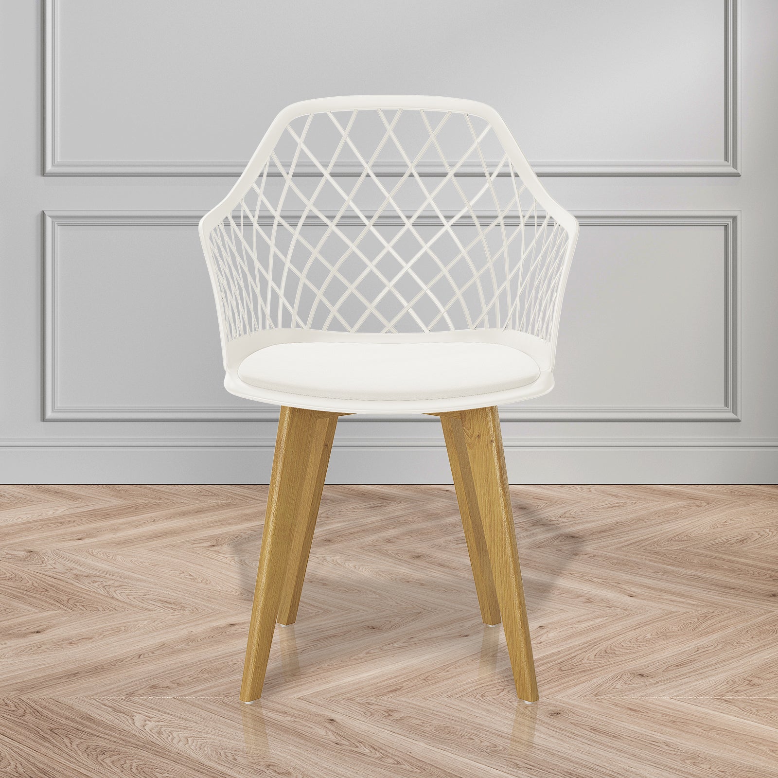 Caesar Beech Dining Chair Set of 4 in Cream White, featuring a white lattice-patterned plastic shell, smooth seat cushion, and angled wooden legs, displayed against a pale gray paneled wall on a herringbone floor.