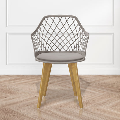 Caesar Beech Wood Dining Chair Grey Set of 6, featuring a close-up of a wicker armrest and floor. Designed for comfort and durability, perfect for enhancing dining spaces with timeless style.