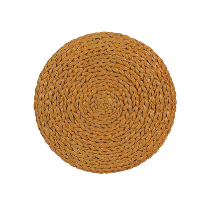Carla 40cm Water Hyacinth Pouffe Ottoman - Honey, featuring a round, braided natural-fiber design, showcasing intricate weaving patterns, ideal for versatile use as a footrest, seat, or table.