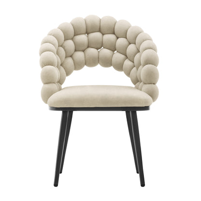 Claudine Velvet Curved Dining Chair Set of 2 in Oatmeal features a sculptural padded back with round pods, a flat upholstered seat, and slender black legs, offering modern elegance and comfort.