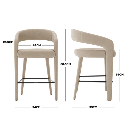 Eisha Velvet Bar Stool Warm Grey Set of 2, showcasing a plush velvet finish with padded seats, curved backs, armrests, and sleek metal legs, ideal for modern dining or bar areas.