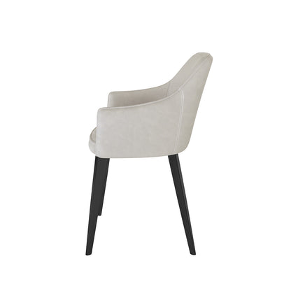 Side view of the Ella Velvet Dining Chair Set of 2 in Beige, featuring plush padded seats, low armrests, and sleek black legs, embodying a blend of designer style and ergonomic comfort.