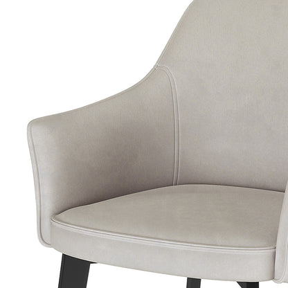 Ella Velvet Dining Chair Set of 2 in Beige, featuring a gently curved back and armrests upholstered in plush beige fabric, supported by sturdy dark-finished legs for a modern, elegant dining experience.