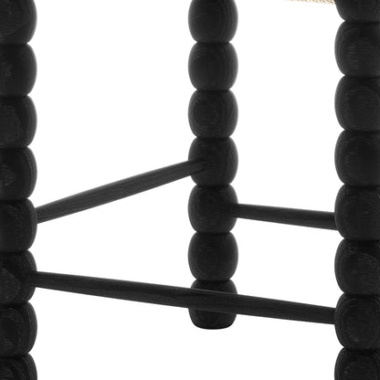 Close-up of Em Solid Oak Dining Chair Set of 2 - Black, highlighting the bobbin-style frame and woven natural fiber seat, showcasing durable craftsmanship and classic design.