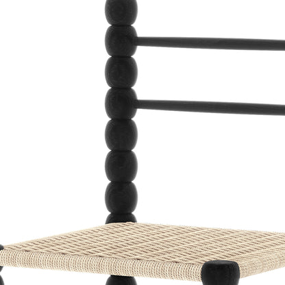 Close-up of the Em Solid Oak Dining Chair Set of 2 - Black, featuring a bobbin-style frame and woven natural fibre seat, highlighting its solid American oak craftsmanship and timeless design.